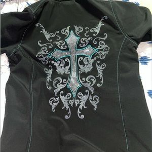 Jacket with turquoise and bling cross designs.